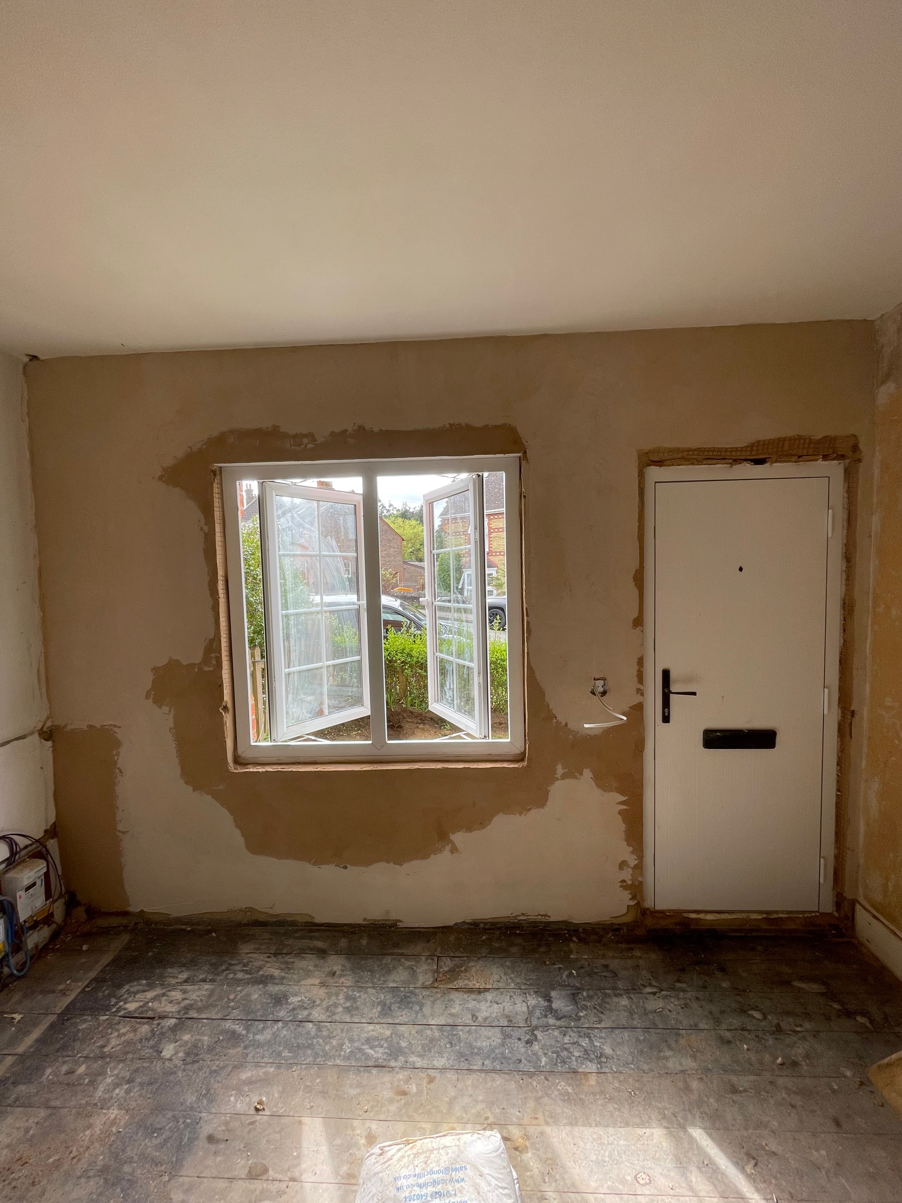 Heritage room with lime plaster and exposed oak beams